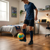 Teen playing with the Kova Sports Silent Indoor Soccer Ball in a bedroom